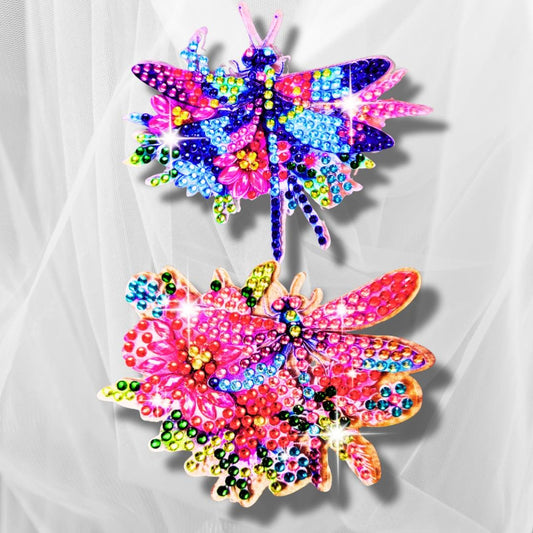 Two colorful butterfly decorations made with beads on a white background